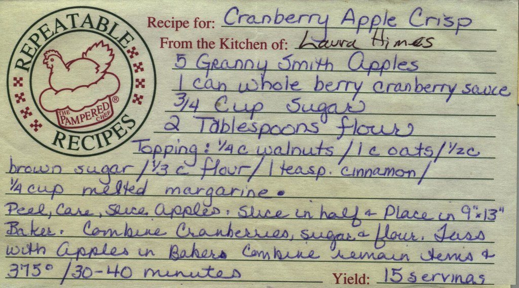 A handwritten cranberry apple crisp recipe on a printed recipe card.